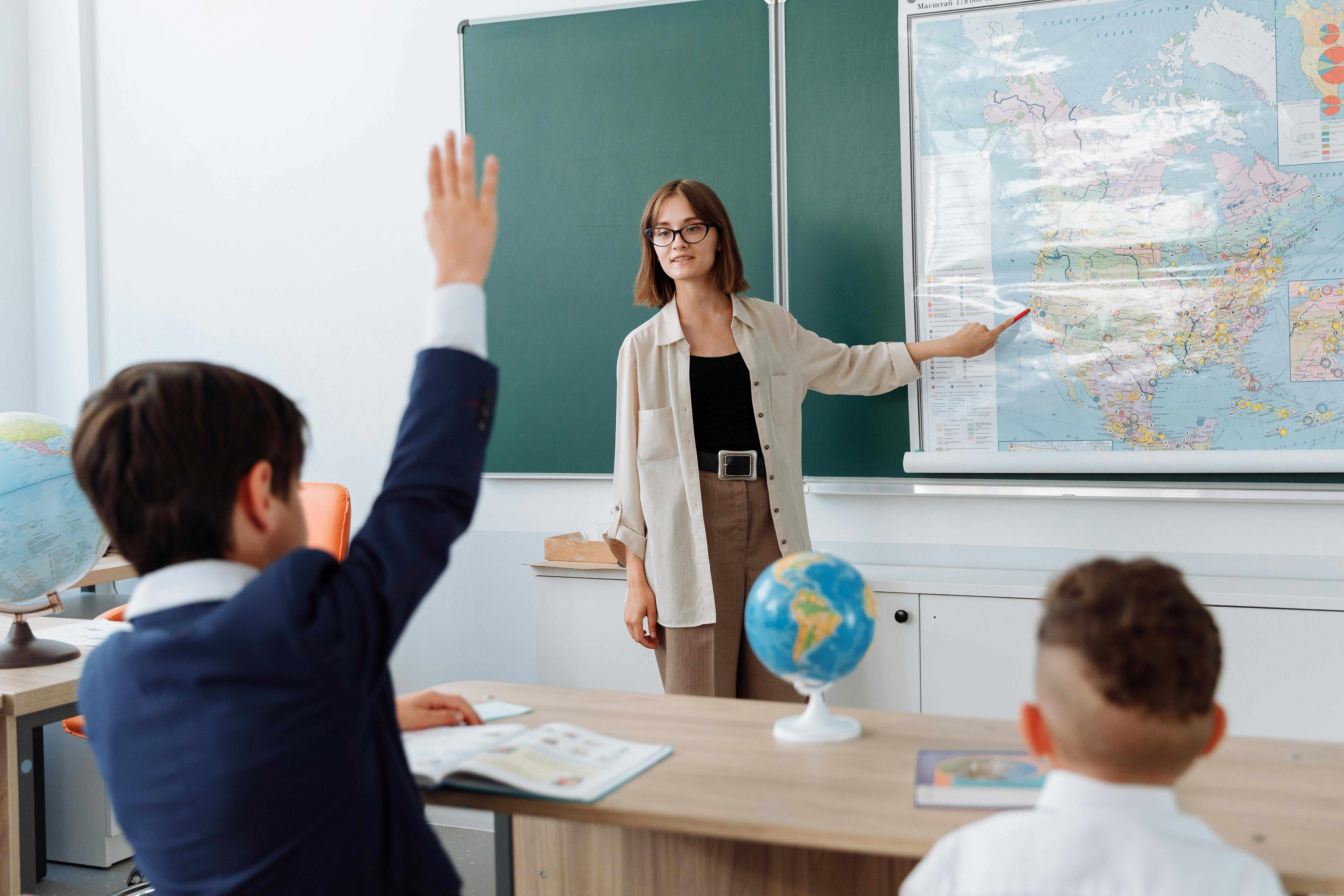 Teacher with students in classroom - Mathematics tutoring